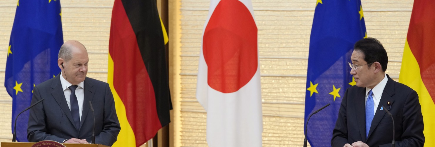 German Chancellor Olaf Scholz, left, listens to his Japanese counterpart Fumio Kishida during a joint press conference in Tokyo, Thursday, April 28, 2022.