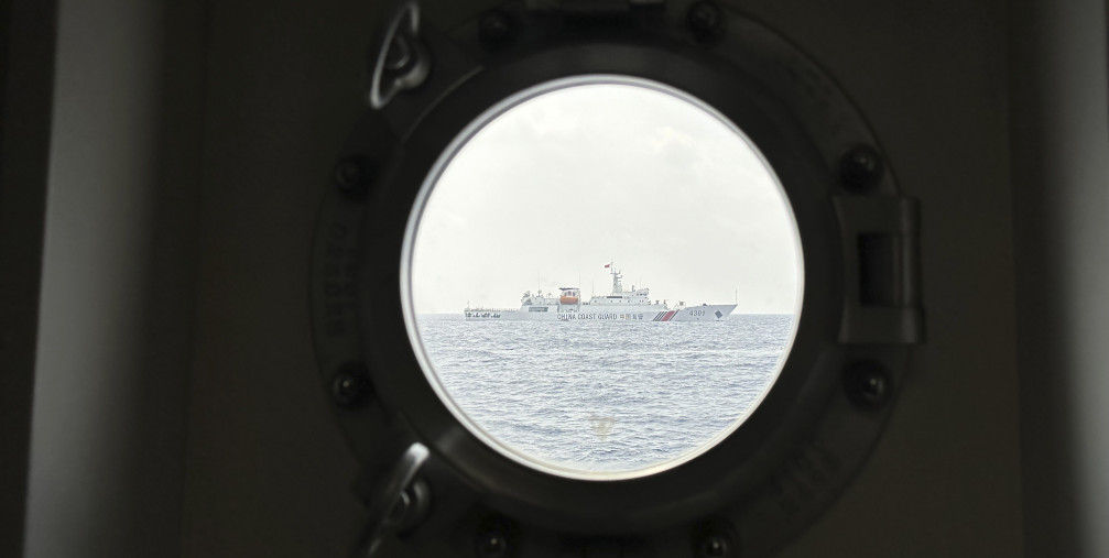 A Chinese coast guard ship blocks Philippine coast guard ship, BRP Sindangan as it tried to head towards Second Thomas Shoal at the disputed South China Sea during rotation and resupply mission on Wednesday, Oct. 4, 2023.