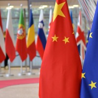  European Union and Chinese flags are pictured during a EU-China summit in Brussels, Belgium.