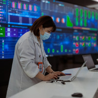 A photo taken during a press tour shows employees working at the Jabil factory producing PCBs (printed circuit boards) and other electronic components, in Wuxi, China, 21 February 2023. 