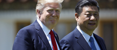 In this April 7, 2017, file photo President Donald Trump and Chinese President Xi Jinping walk together after their meetings at Mar-a-Lago.